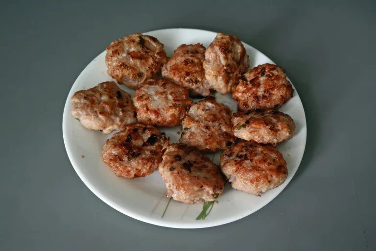 A plate of turkey breakfast sausage links served with eggs and toast.