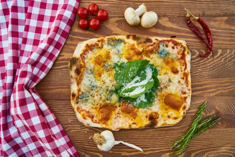 Homemade cottage cheese flatbread, soft and golden brown, served with fresh herbs.