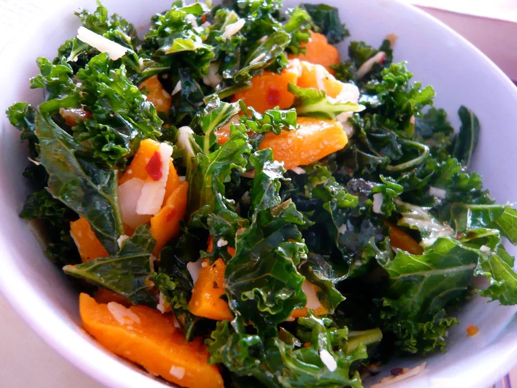 Close-up of fresh kale leaves, the base of a healthy crunch salad.