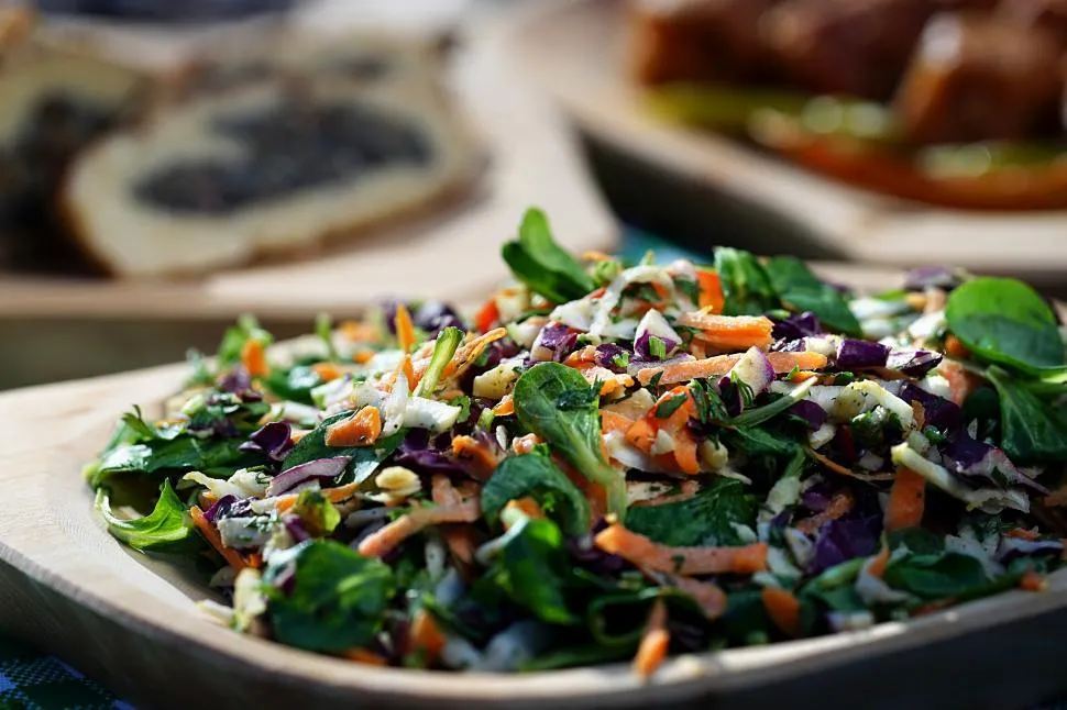 Fresh kale crunch salad with a variety of vegetables and crunchy toppings