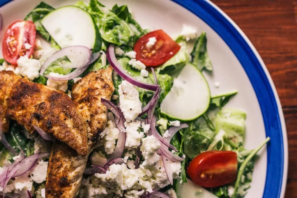 Homemade Costco Chicken Salad in a bowl with fresh ingredients and creamy dressing.