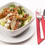Homemade Costco Chicken Salad served in a bowl with fresh ingredients.