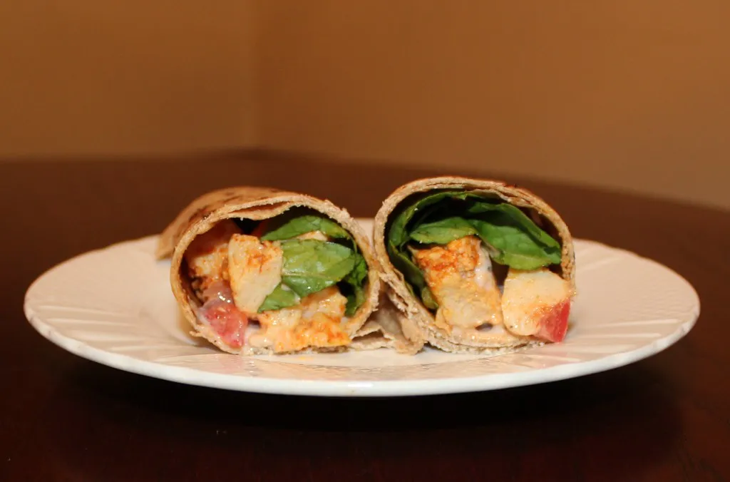 Delicious vegetarian Caesar wrap with crispy romaine lettuce, creamy Caesar dressing, Parmesan cheese, and plant-based protein in a soft tortilla