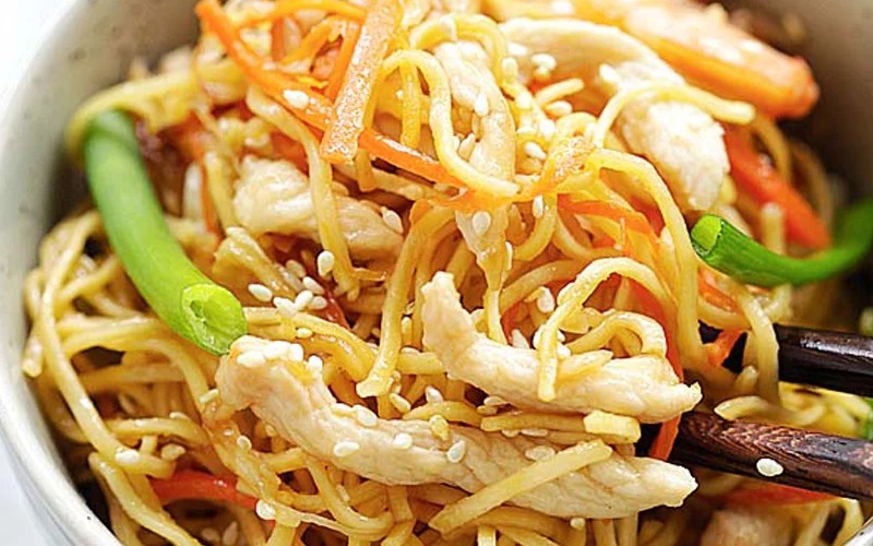 A warm and hearty dish featuring tender chicken, thick egg noodles, and creamy mashed potatoes.