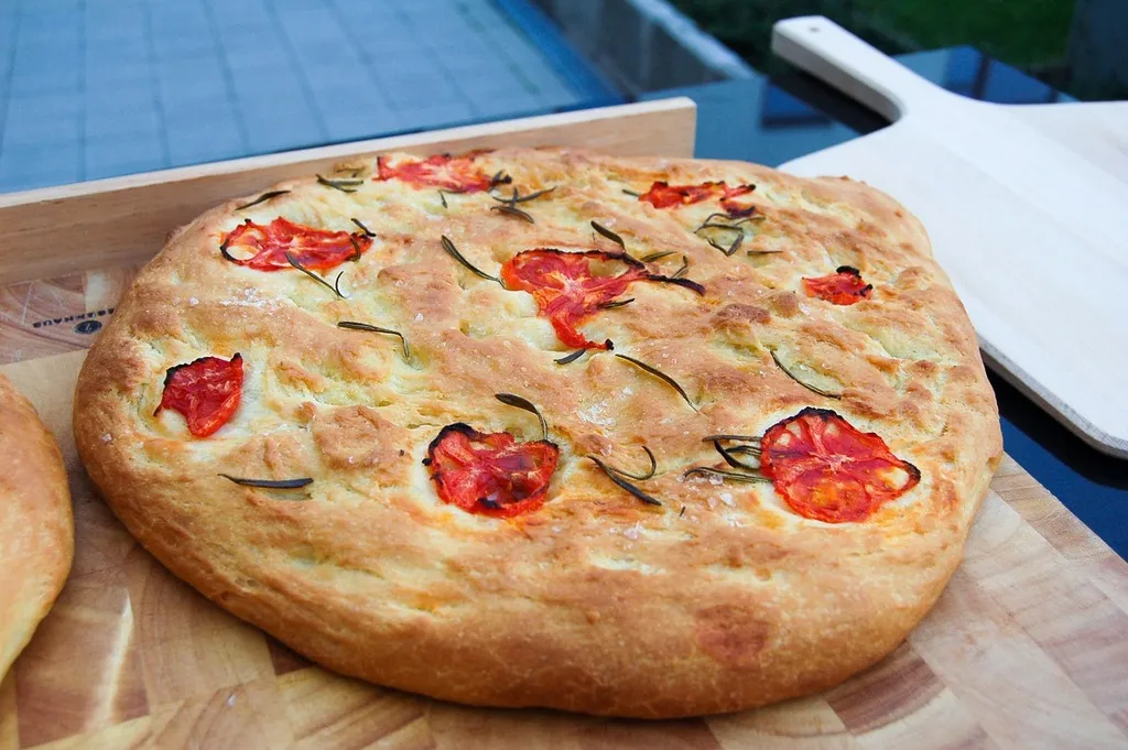 Golden, crispy focaccia pizza with a perfect blend of melted cheese and savory toppings, ready to be enjoyed