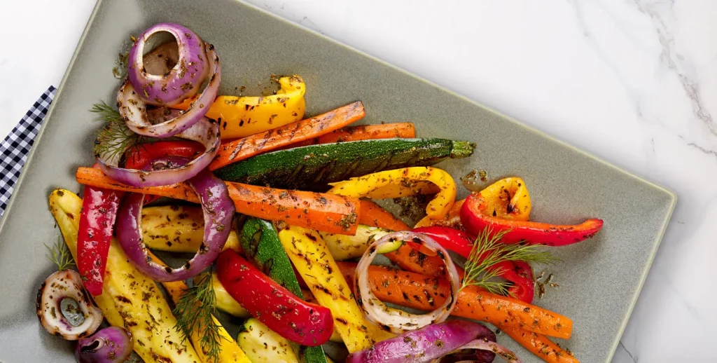 Colorful Italian Roasted Vegetable Medley with zucchini, bell peppers, cherry tomatoes, and red onion, perfectly caramelized and seasoned with olive oil and Italian herbs.