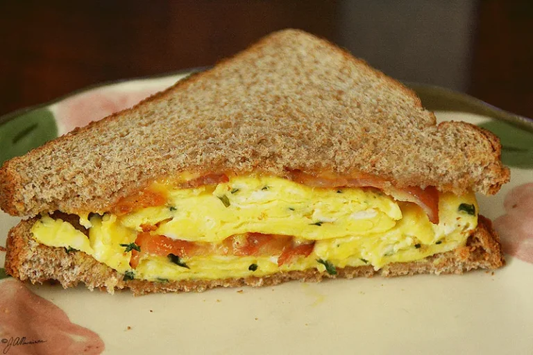 Kirkland breakfast sandwich with English muffin, egg, cheese, and sausage, showcasing a quick and tasty breakfast option