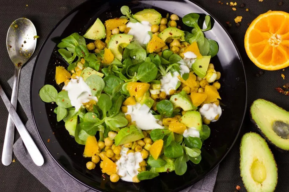 Fresh and vibrant avocado salad with mixed greens, cherry tomatoes, and a light dressing, perfect for a healthy and delicious meal.