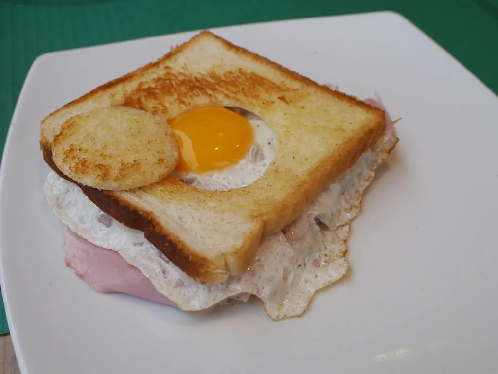 "Delicious Kirkland breakfast sandwich with a soft, toasted muffin, a perfectly cooked egg, melted cheese, and a juicy sausage patty, ideal for a satisfying breakfast on the go