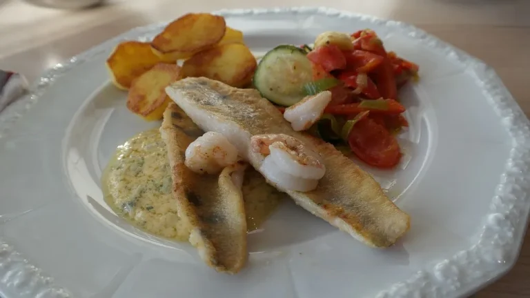 Baked fish fillets perfectly seasoned with herbs, lemon, and a golden crust, ready to enjoy.