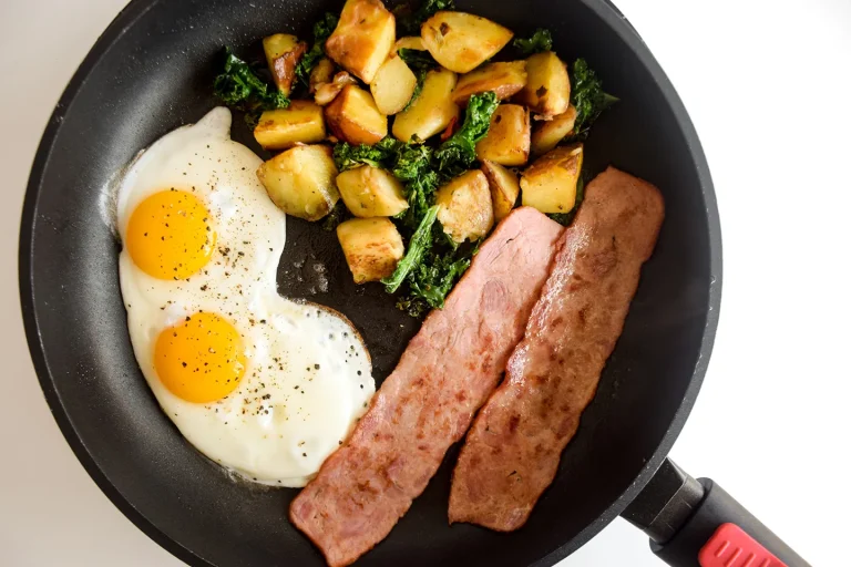Crispy frozen breakfast potatoes served in a cast iron skillet, garnished with herbs and ready to eat