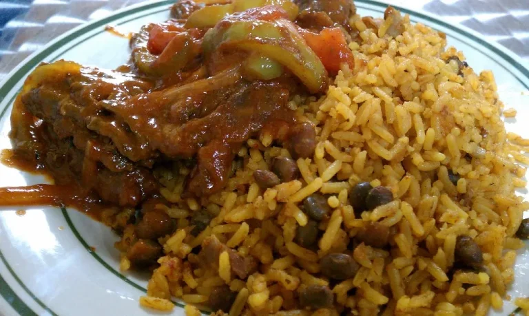 Delicious Arroz con Gandules served in a traditional Puerto Rican dish, featuring fluffy rice, pigeon peas, and vibrant sofrito.