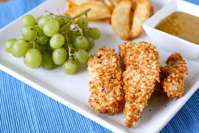 Golden crispy chicken tenders served on a plate