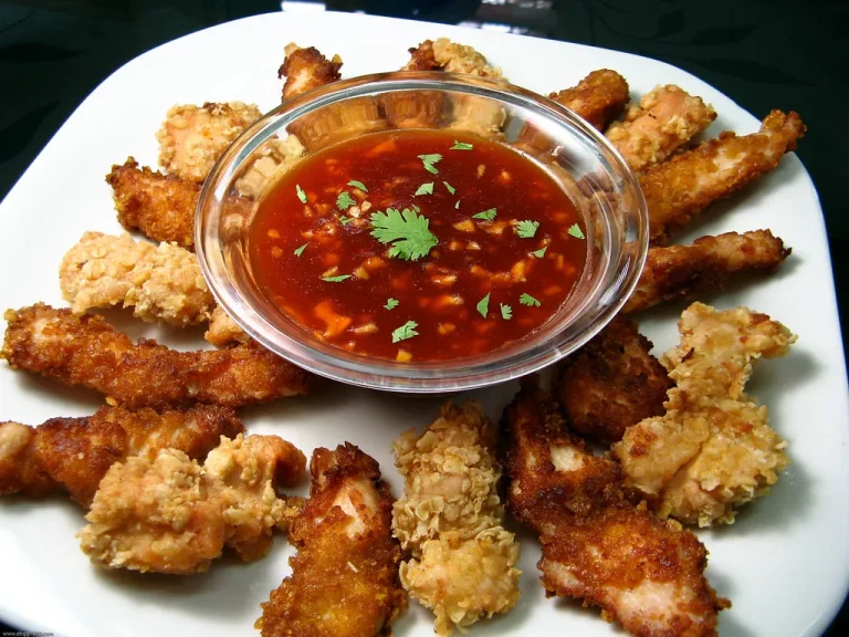 Assortment of crispy and flavorful chicken tenders with dipping sauces