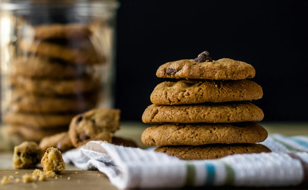 A plate with assorted cookies from Crumbl, Dirty Dough, and Levain for a comparison taste test