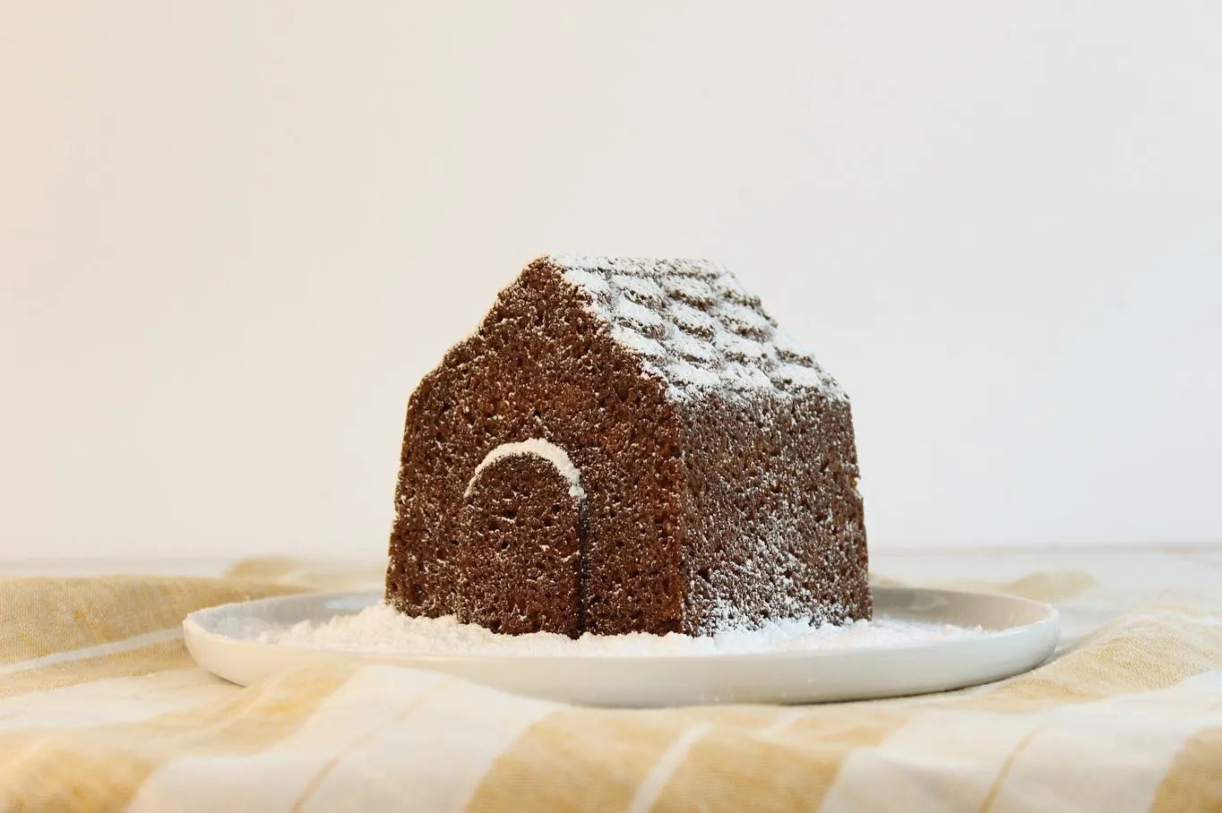 Tomte Cake decorated with festive icing and spices, capturing the cozy and charming essence of Scandinavian holiday desserts.
