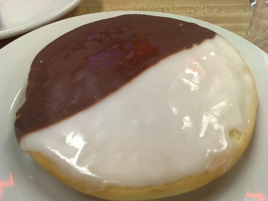 Close-up of a black and white cookie trifle with visible vanilla and chocolate layers