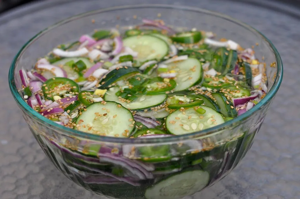 Cucumber and onion slices marinating in vinegar dressing