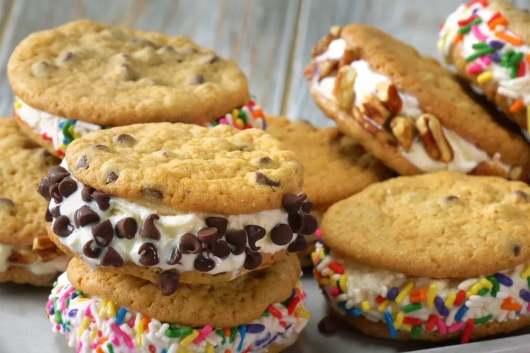 Assorted food truck-style desserts including churros, mini donuts, funnel cake, and ice cream sandwiches displayed on a colorful dessert table.