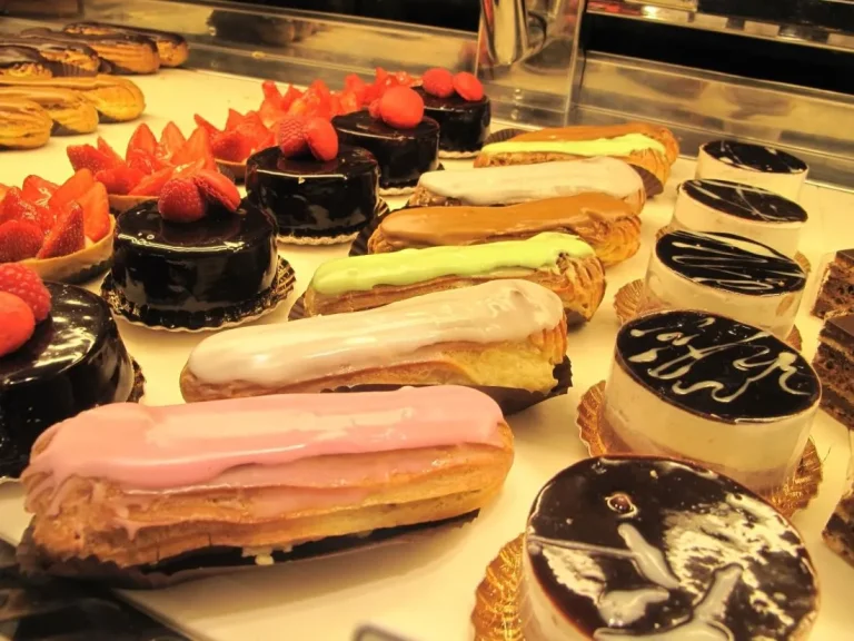 Elegant French desserts on rustic plates with fresh fruit garnish