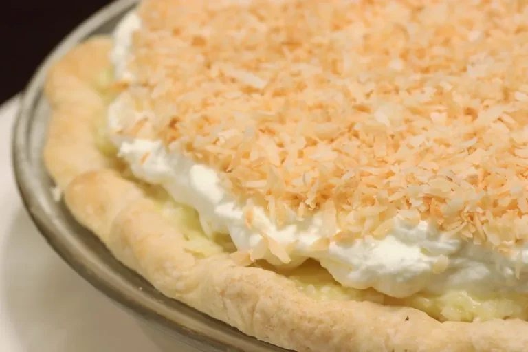 Quick and creamy coconut cream pie topped with fluffy whipped cream and toasted shredded coconut