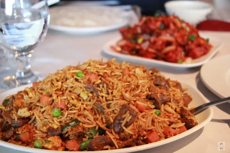 Traditional Indian rice dish served in a bowl with aromatic spices and fresh herbs