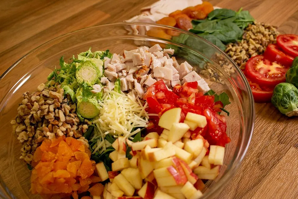 Essential ingredients for homemade turkey salad neatly arranged on a table