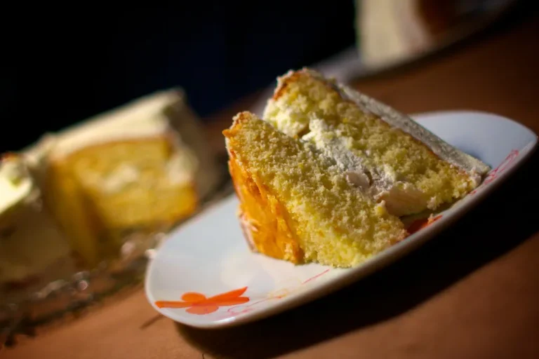 Layered banana cream cake with creamy filling and decorative toppings ready to serve