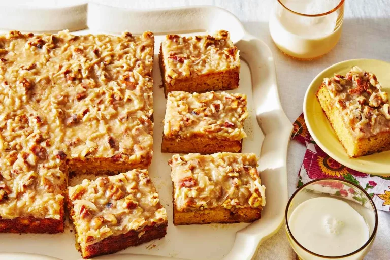 Whole Do Nothing Cake in a 9x13 baking dish, garnished with chopped pecans and coconut