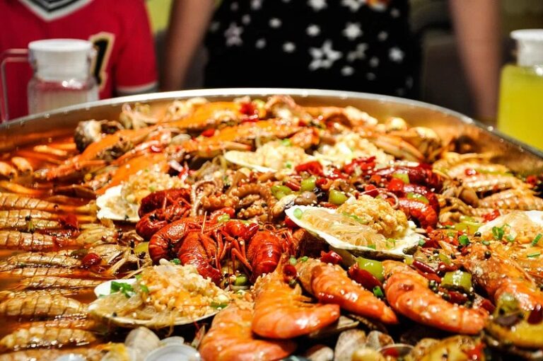 Colorful seafood dish featuring shrimp, scallops, mussels, and calamari garnished with parsley and lemon, ideal for easy and flavorful sea fruits recipes.