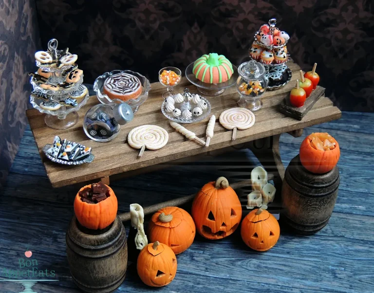 A festive Halloween candy spread featuring Reese’s, Candy Corn, and chocolate bars on a spooky table.