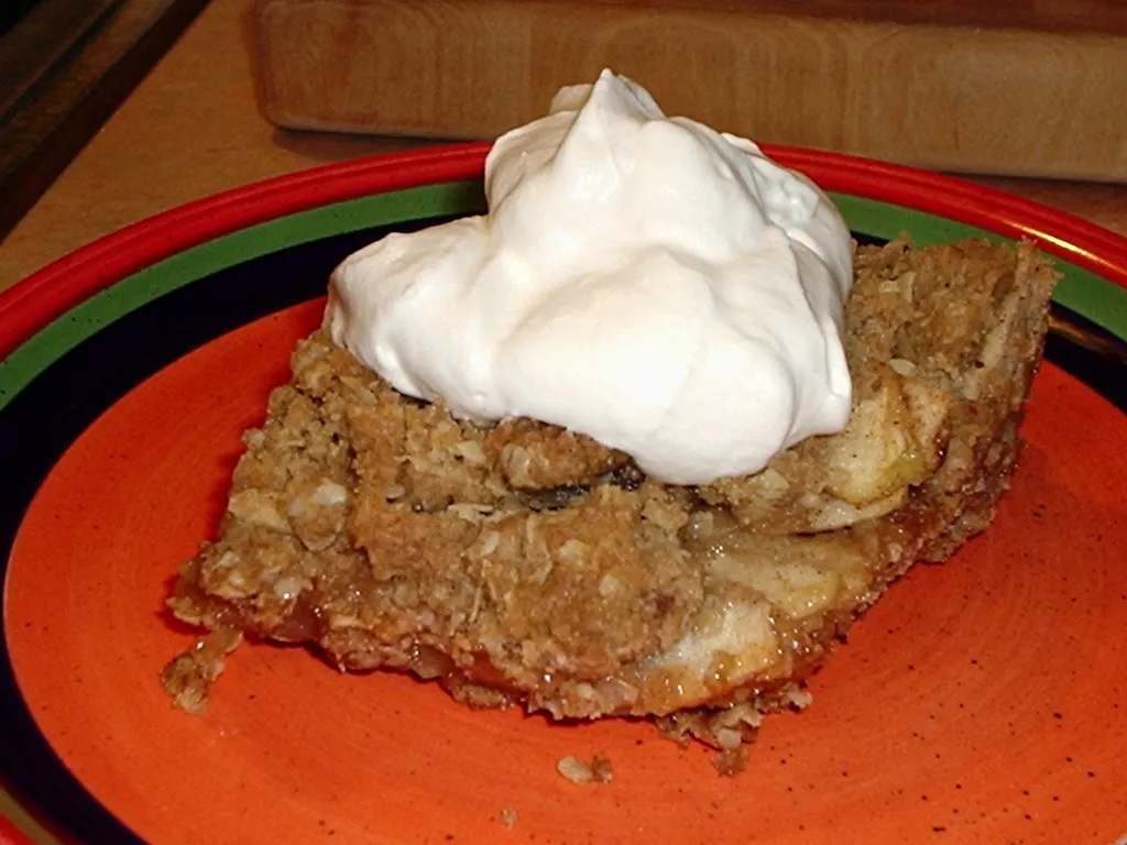 Warm homemade apple crisp with golden oat topping and cinnamon-spiced apples.