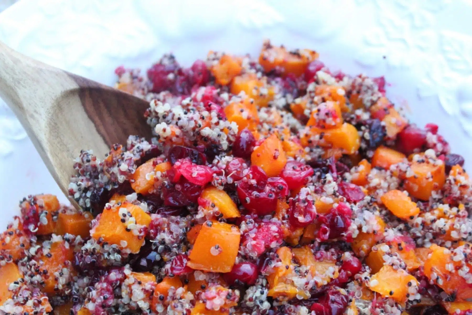 Autumn harvest salad with kale, roasted butternut squash, apples, nuts, and goat cheese.