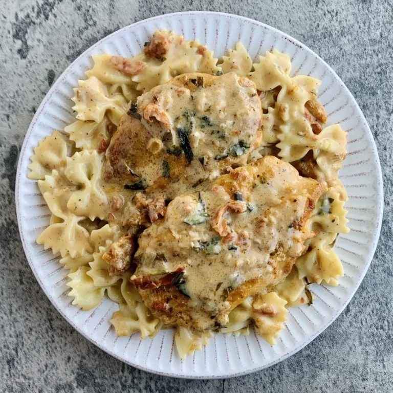 A plate of Marry Me Pasta garnished with basil and Parmesan cheese.