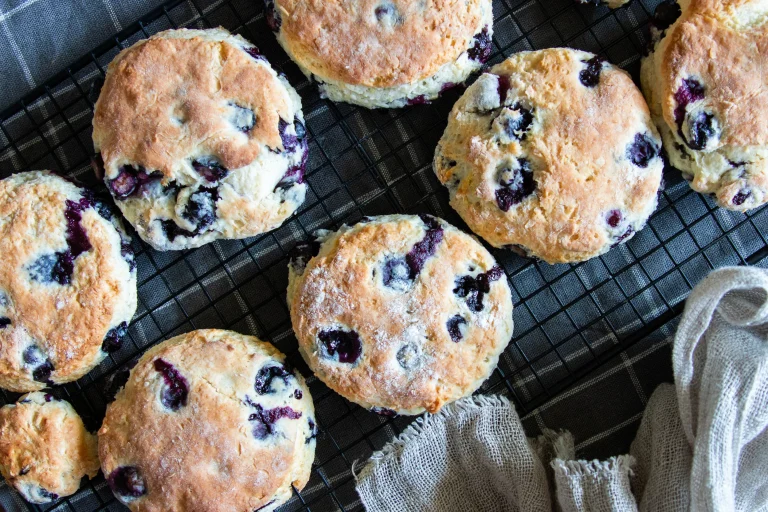 Close-up of fluffy blueberry scones with butter and jam