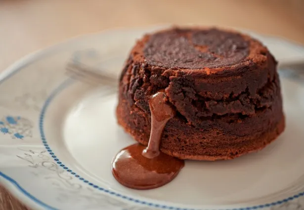 Delicious homemade chocolate lava cake with gooey molten center served in a ramekin