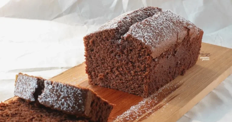 Viral chocolate loaf with shiny ganache drizzle on a cooling rack, bakery-style slices, rich cocoa texture.