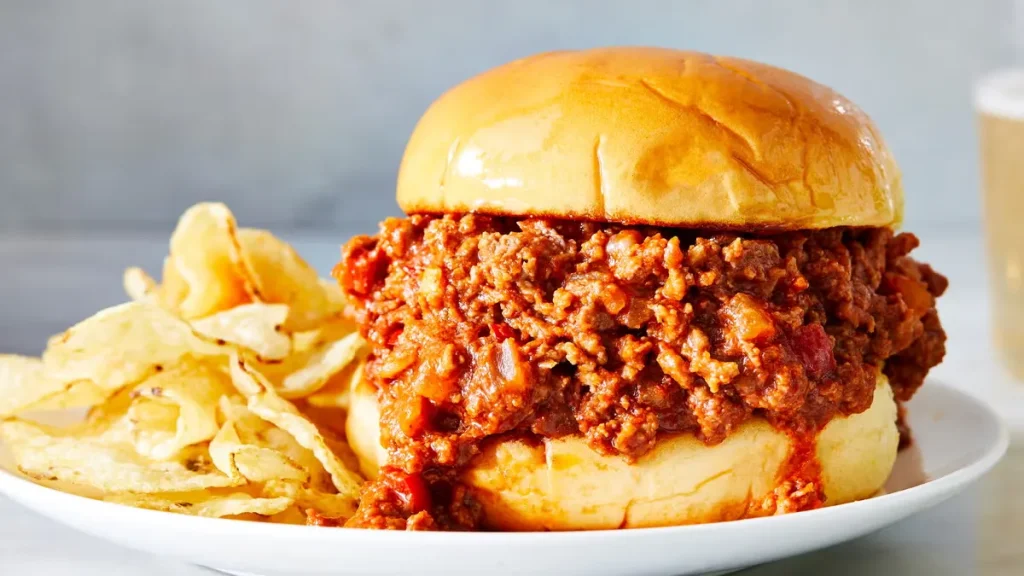 Juicy Sloppy Joes sandwich with ground beef and tangy tomato sauce on a soft hamburger bun